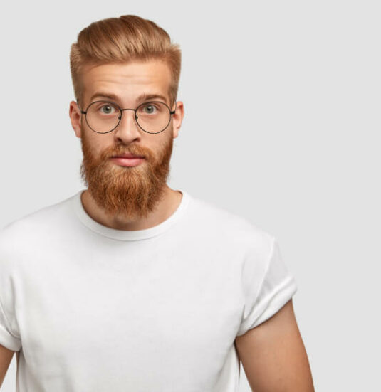 Confident Ginger Man With Trendy Hairstyle Wears Spectacles Looks Directly 1 1 Confident Ginger Man With Trendy Hairstyle Wears Spectacles Looks Directly 1 1