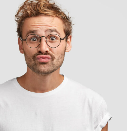 Funny Curious Man Makes Grimace Purses Lips Looks Doubtfully 1 Funny Curious Man Makes Grimace Purses Lips Looks Doubtfully 1