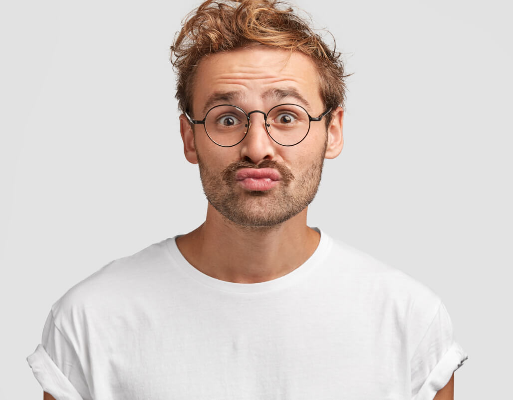 Funny Curious Man Makes Grimace Purses Lips Looks Doubtfully 1